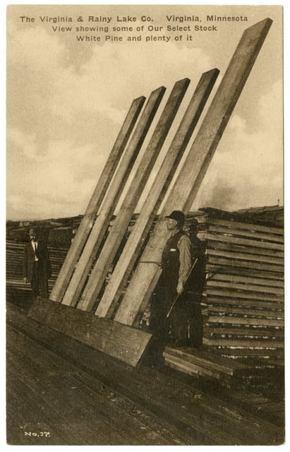 Five wooden boards lean against a wooden frame, flanked by two men.