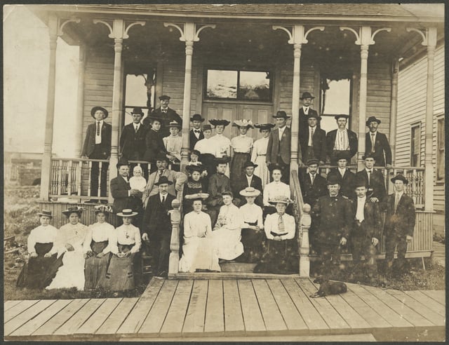 Black and white photograph of a Finnish Lutheran congregation in front of Finnish Temperance Hall, Mt. Iron, 1896.