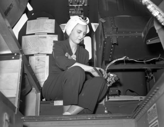 Woman working on the wiring of a B-24 Liberator bomber