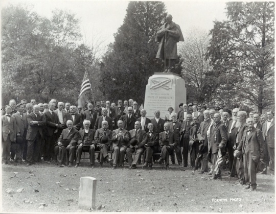 Veterans and Minnesota officials at the Minnesota monument in Little Rock National Cemetery