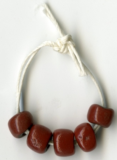 Color image of dark red trade beads.