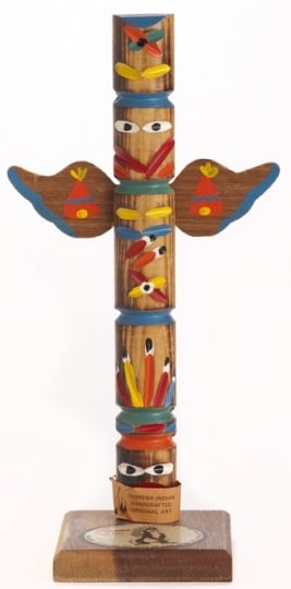 A souvenir totem pole, created ca. 1970, with a depiction of the Hamm’s bear. This piece is a good example of Hamm’s Brewing Company’s use of generic and often inaccurate Indigenous iconography in their advertising. Although this object was made by an Ojibwe family, totem-pole carving is not an Anishinaabe tradition the art form is practiced by Indigenous groups on the West Coast of the United States and Canada, including the Haida, the Tlingit, and the Nuxalk.