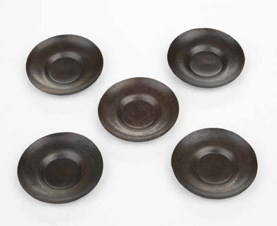 Tea-cup saucers for a doll