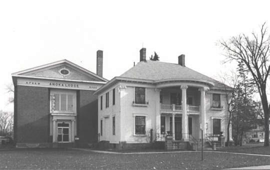 Photograph showing Colonial Hall (right, built in 1904) after Masonic Lodge No. 30 (left, built in 1922) was built beside it. Photographer unknown, ca. 1970s.
