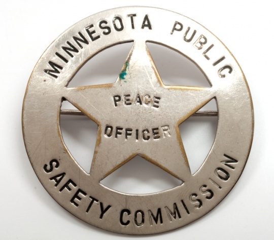 Color image of Minnesota Commission of Public Safety Peace Officer badge.