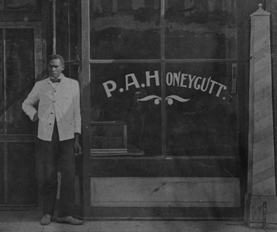 Prince Honeycutt outside his barbershop