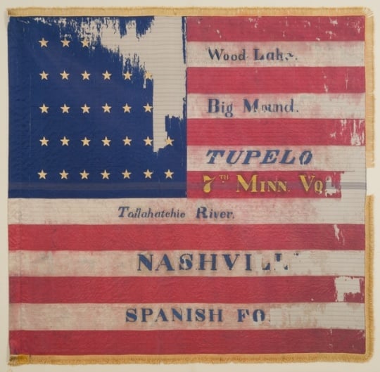 Tattered battle flag of the Seventh Minnesota Infantry Regiment.