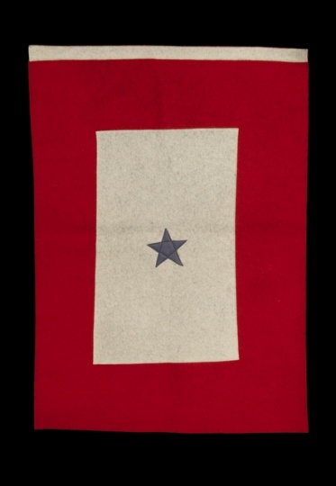 Color image of a red and white felt service flag with one blue star, used by the family of Harvey Mears, who served in World War I and World War II, ca. 1915–1943.