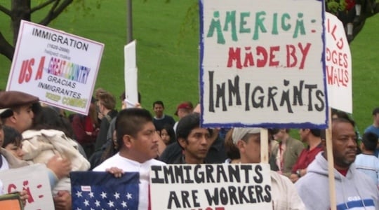 Color image of demonstrators gathering in St. Paul to show their support for immigrants’ and immigrant-workers’ rights, 2006. Photographed by Mary Turk.