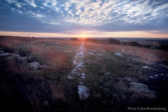 Color image of a sunrise during the autumnal equinox in Blue Mounds State Park, 1990.