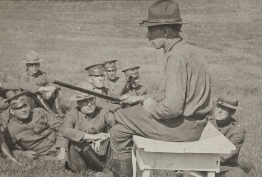 Black and white photograph of Colonel Bellows of the Minnesota National Guard giving instruction in riot stick usage. Camp Lakeview, Lake City, Minnesota, September, 1918.