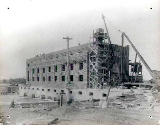 Construction of the power plant at the north end of the Coon Rapids Dam.