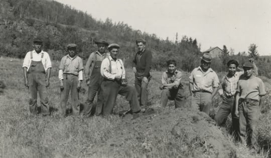 Black and white photograph of Indian Civilian Conservation Corps crew on the stockade site at the end of the first day of work, Grand Portage, Minnesota, 1937. Photographed by Willoughby Maynard Babcock, Jr.
