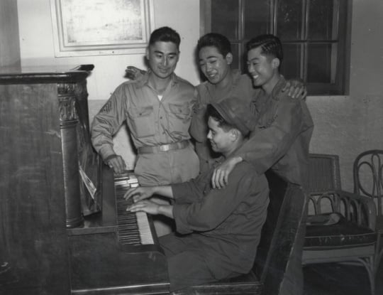 Black and white photograph of Japanese American soldiers at Fort Snelling, VJ Day, 1945.