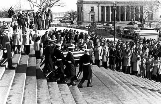 Black and white photograph of color Guard officers carrying the body of Hubert H. Humphrey down the steps of the Minnesota State Capitol in St. Paul, January 1978.