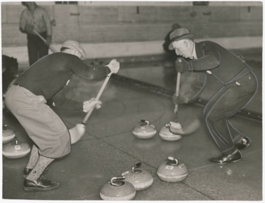 A curling game, 1937. Curling was introduced to Minnesota in the 1850s. Shown is action ca. 1935.