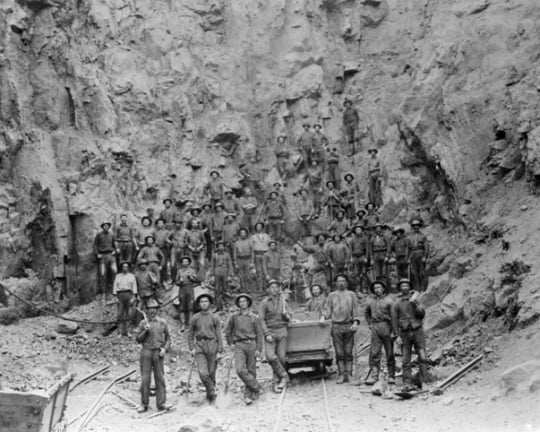 Black and white photograph of miners in the pit of the Tower-Soudan mine, 1890.