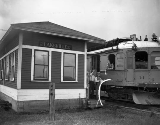 Black and white photograph of the last run of passenger service on the Minneapolis, Northfield and Southern Railway at the station for Lakeville, 1942.
