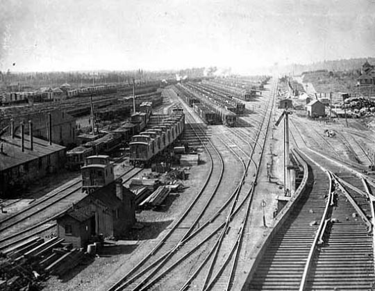 Black and white photograph of the large classification yard and part of the shops complex at Proctor, 1900.