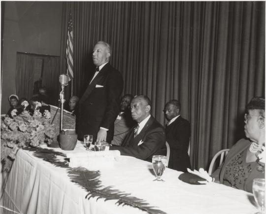 Black and white photograph of a Frank Boyd testimonial dinner, with A. Philip Randolph standing, 1951.