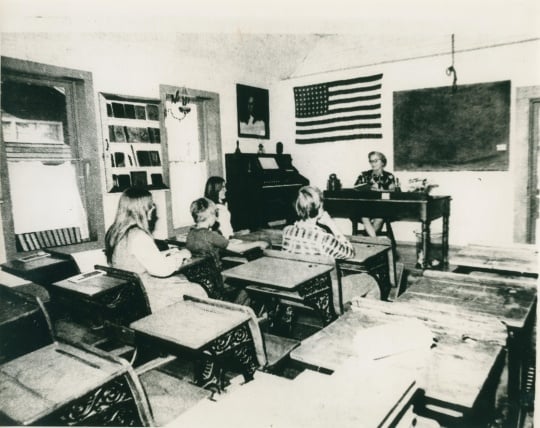 Volunteer teacher inside Huset School