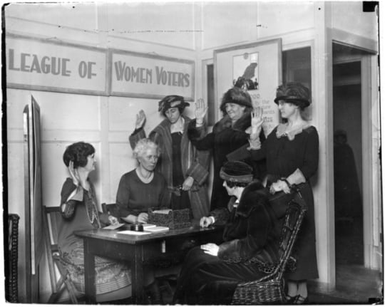 League of Women Voters swearing in new members or registering women to vote, ca. 1923.