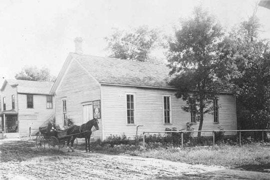 Black and white photograph of a Grange Hall, in Bloomington, c.1890.