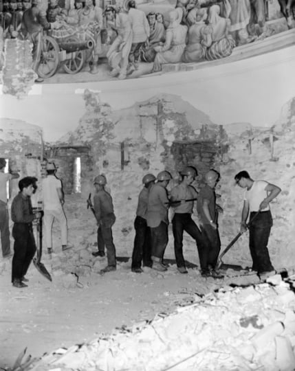 Black and white photograph of a crew excavating in the Round Tower at Fort Snelling in preparation for restoration, 1965. Photographed by Terry Garvey.