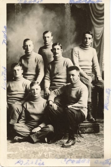 Black and white photograph of seven charter members of a secret society known as The Greys, 1910. The group became the Nu Upsilon Gamma fraternity in 1920, disbanded in the 1990s and reactivated in 2001.
