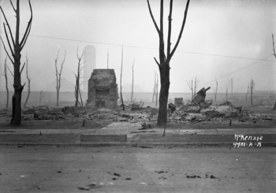 Black and white photograph of building ruins, Cloquet, 1918.