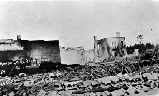Black and white photograph of street view after fire, Moose Lake, 1918.