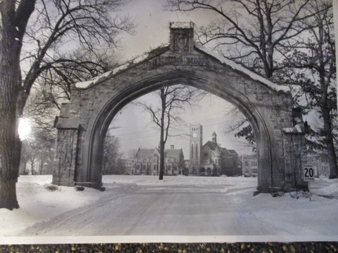 Black and white photograph of Shattuck School, Faribault, c.1949. The arch and Shumway, designed in 1886, and Morgan Refectory designed in 1888.