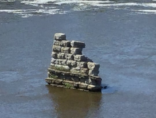 Color image of an abandoned bridge pier in the Mississippi River, downtown Minneapolis, 2016. Photograph by Paul Nelson.