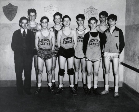 Black and white photograph of a young men's basketball team at the Jewish Educational Center in Saint Paul, c.1940.