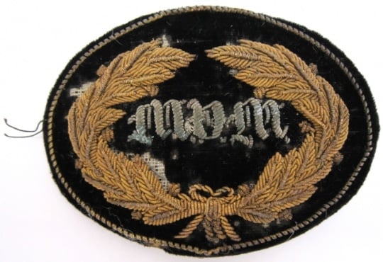 United States Army General and Staff officers hat insignia worn during the Civil War by General John B. Sanborn of the 4th Minnesota Regiment. The velvet patch is embroidered in bullion with a wreath and the letters MVM (Minnesota Volunteer Militia).