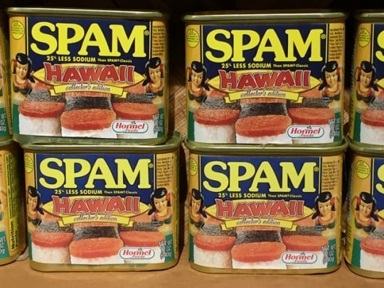 Cans of SPAM with Hawaiian-themed packaging