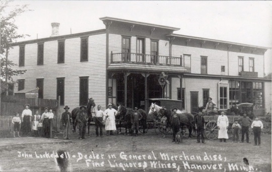 Black and white photograph of John Lockedell General Merchandise & Fine Liquors, ca. 1900–1910.