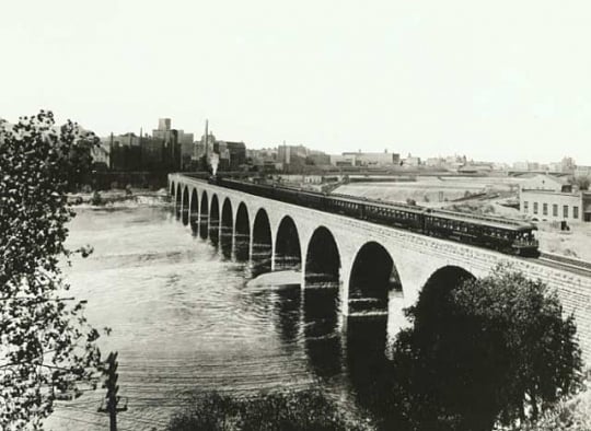 Train on the Stone Arch Bridge crossing the Mississippi River, Minneapolis mill