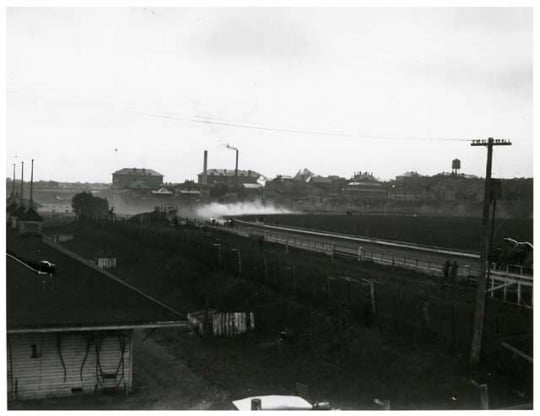 Black and white photograph of a auto race at the 1917 Minnesota State Fair.