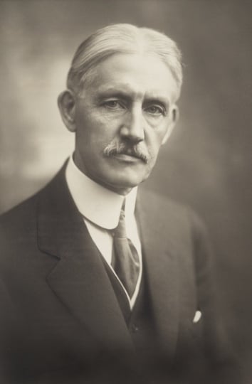 Black and white photograph of Clarence Johnston, ca. 1919.