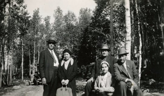 Black and white photograph of Molter family and friend, ca. 1930.