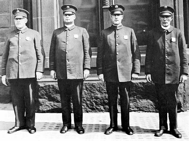 Duluth policemen, group photo.  Oscar G. Olson (August 9, 1887 - December 1, 1941), Police Lieutenant, second from left.