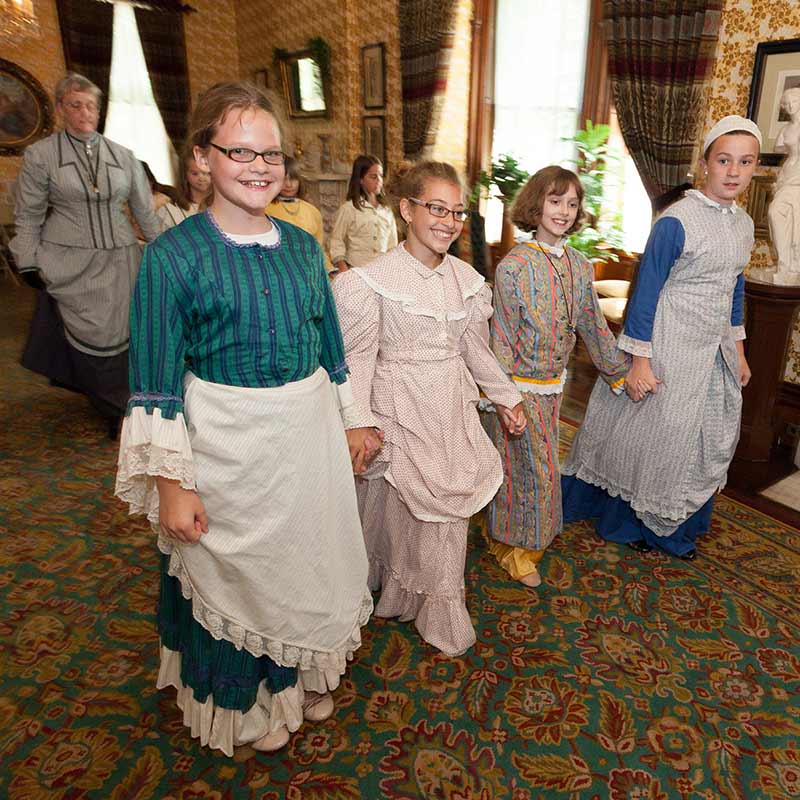 Row of girls in dresses from Ramsey era.
