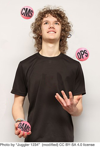 Young man in black t-shirt juggling three pink balls labeled: CMS, DMC, and DAMS