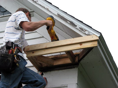 Worker repairing a roof.