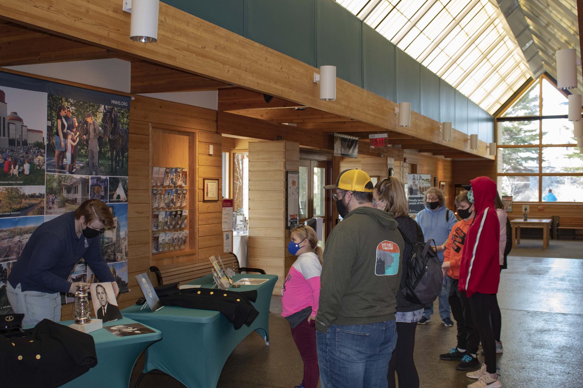 A group of people at the Split Rock Lighthouse visitor center.