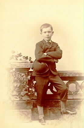 Louis as a child, posing in front of a railing