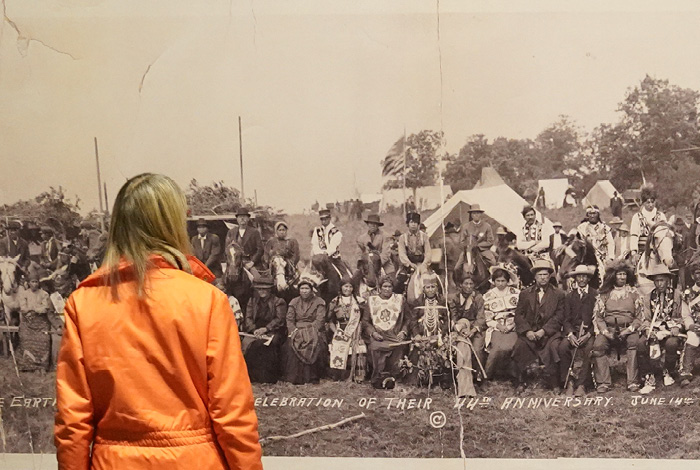 Woman looking at a historic photo.