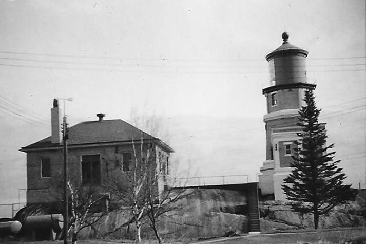 A building and the lighthouse from the back