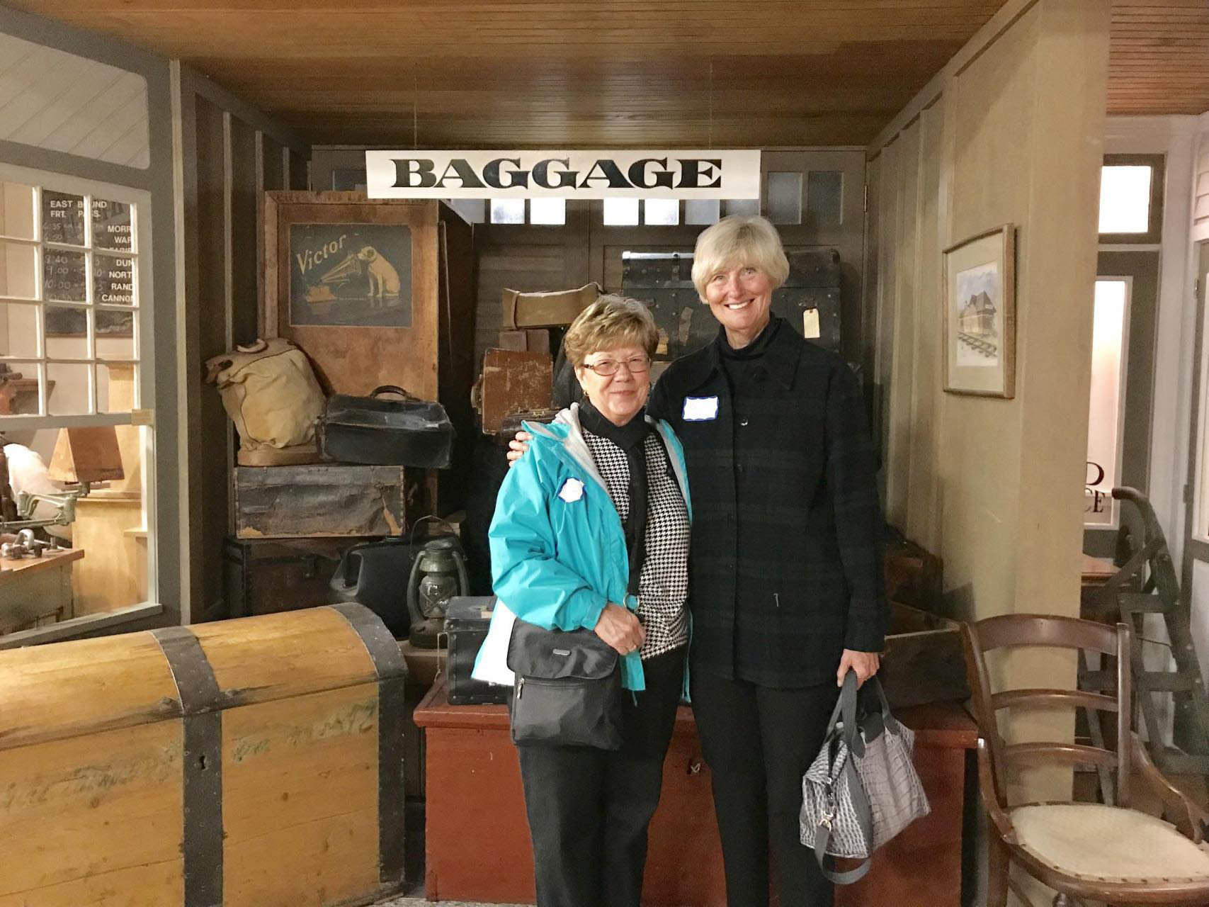 Two women at a historic train station.